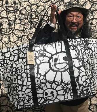 Bright floral tote bag featuring Murakami's signature smiling flower design.