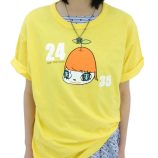 Bright yellow T-shirt featuring a cartoon character with a large orange head and Japanese text, insp.