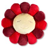 Flower plush pillow with smiling face, red and yellow petals, soft and decorative.