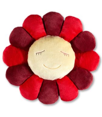 Flower plush pillow with smiling face, red and yellow petals, soft and decorative.