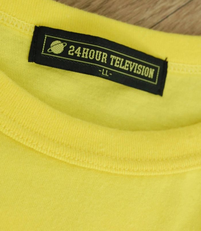 Yellow T-shirt featuring "24HOUR TELEVISION" label and planet logo.