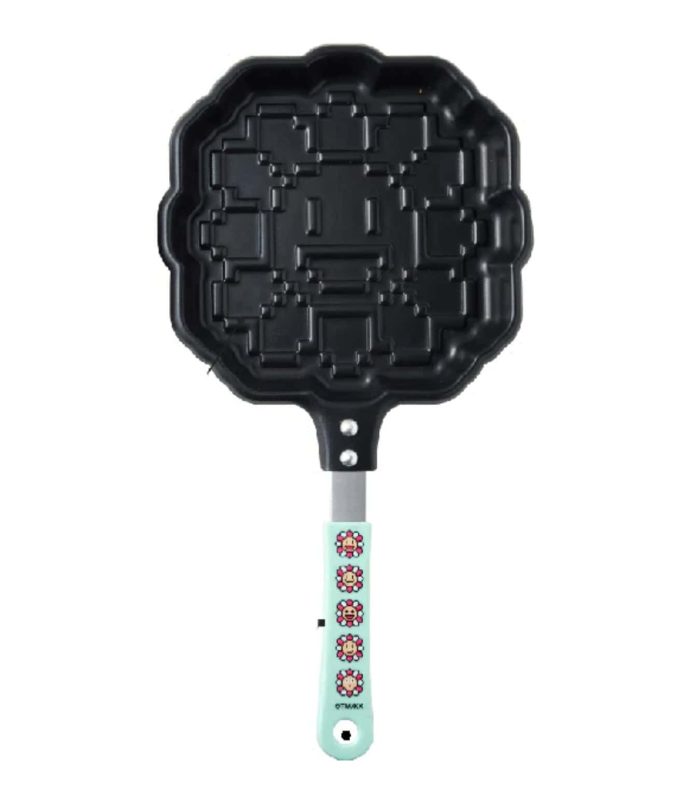 Pixel Flower pancake maker with blue handle inspired by Takashi Murakami's art. Perfect for creative.