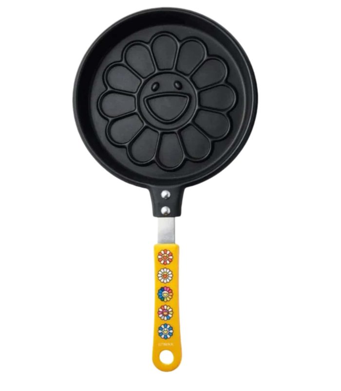 Pancake maker with flower design and yellow handle, inspired by Takashi Murakami's art, perfect for.