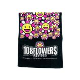 Vibrant Takashi Murakami 108 Flowers towel with colorful pixel art design.