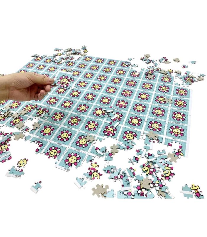 Colorful Murakami Flowers jigsaw puzzle with 900 pieces, featuring vibrant floral artwork.