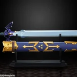 Detailed image of a legendary sword with ornate hilt and matching shield on a black background.