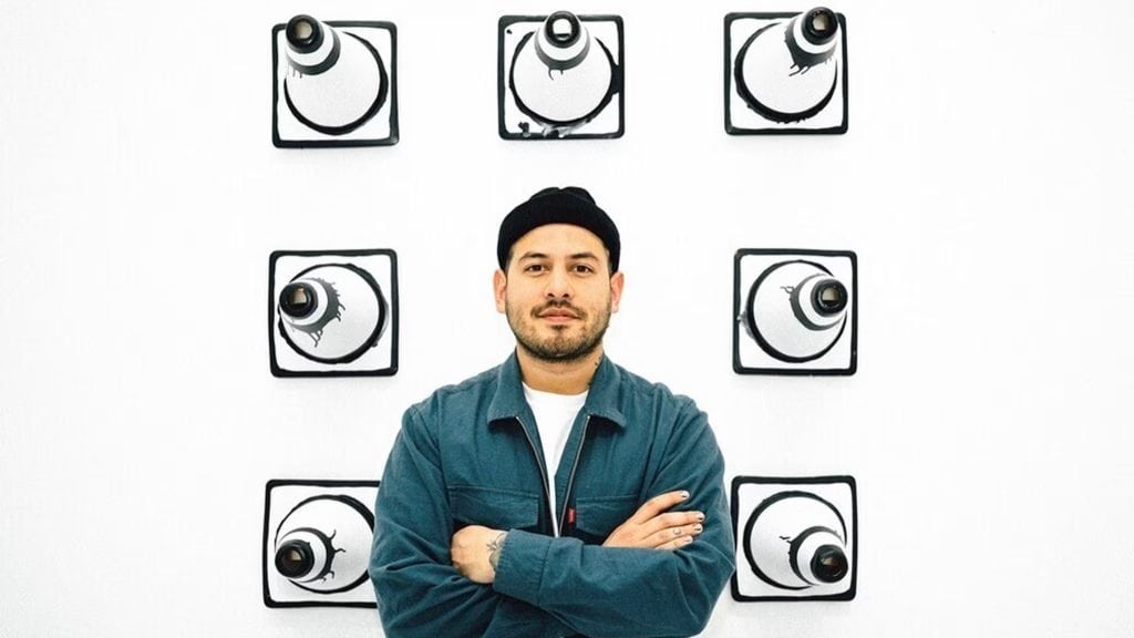 Man standing in front of G-SHOCK DW-5600JV-7JR wall display.