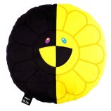 Bright yellow and black plush pillow with a cheerful smiley face design.