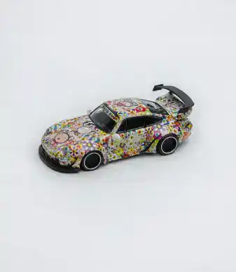 Custom decorated toy car with colorful floral and geometric patterns.