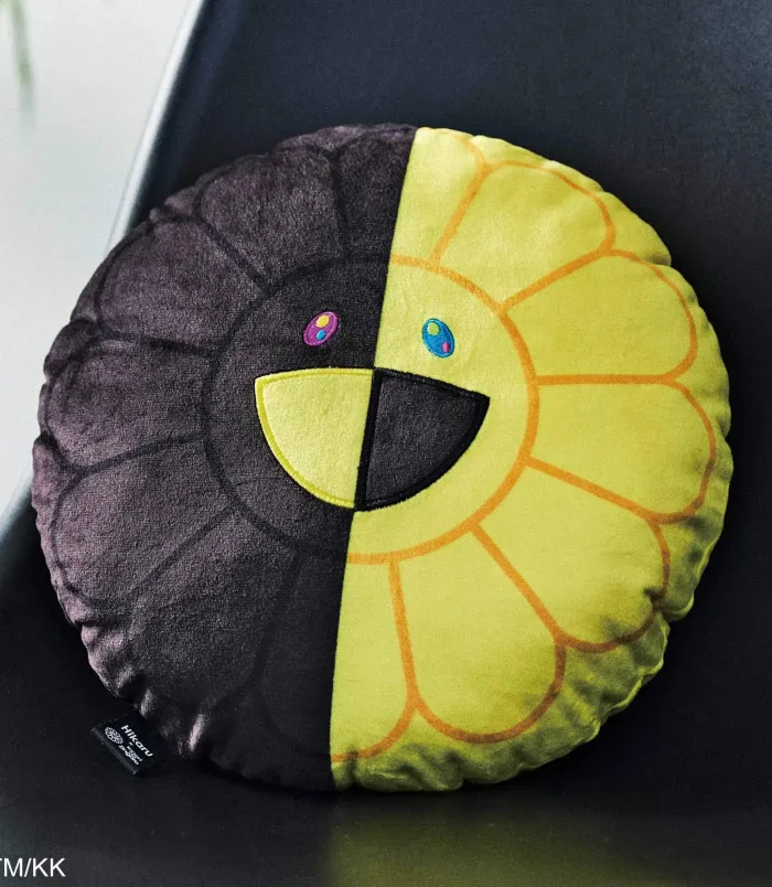 Sunflower plush pillow with a smiling face, half yellow petals, and a dark brown center. Perfect for.