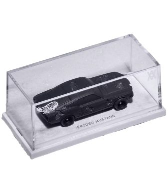 Eroded Mustang Hot Wheels die-cast car in display case.