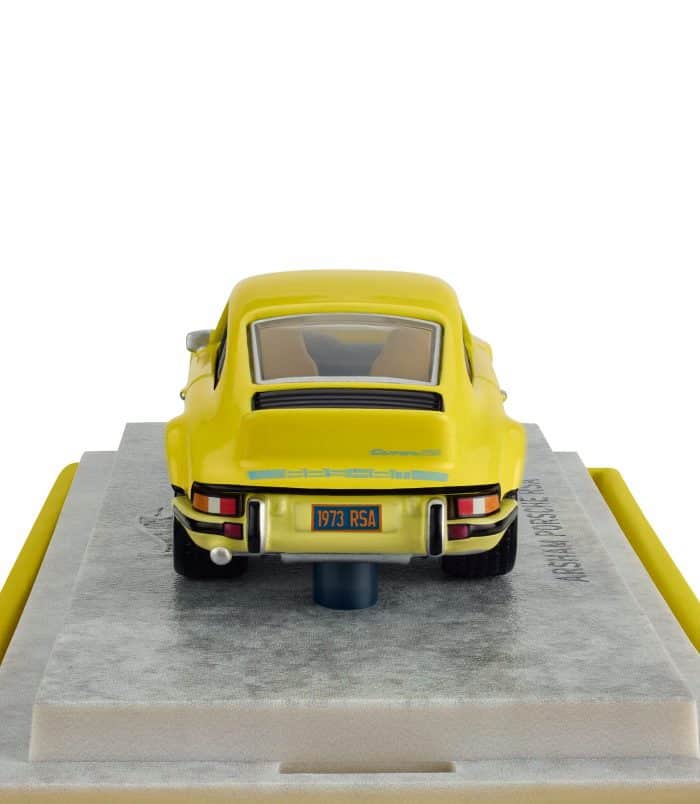 Vintage yellow Porsche model car on display at Rare Inventory. Classic yellow Porsche diecast model with detailed features and authentic design.