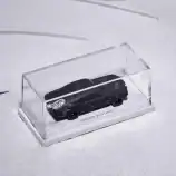 Black Hot Wheels Eroded Mustang in clear display case on snow.