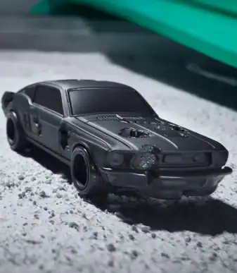Vintage black toy car with detailed features, perfect for collectors and enthusiasts.
