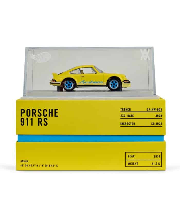 Porsche 911 RS Diecast Model in Display Case Diecast Porsche 911 RS model in clear display case, collectible car replica for enthusiasts.